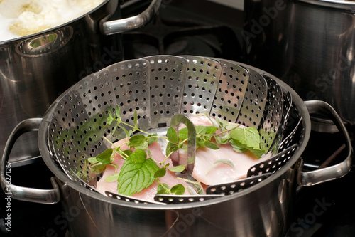 Meat steam cooking in stainless pot