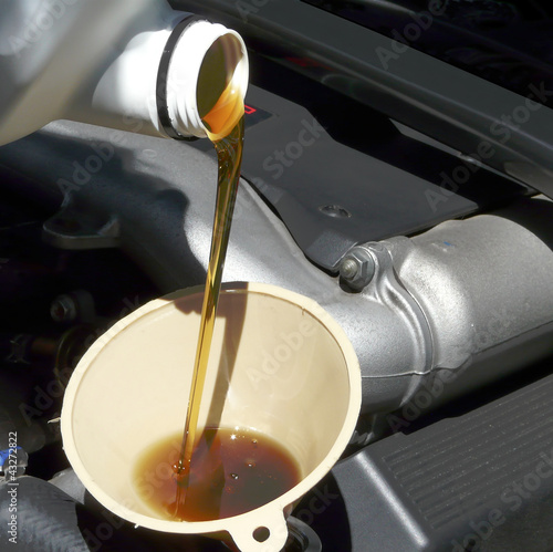 Adding Oil to Car Closeup