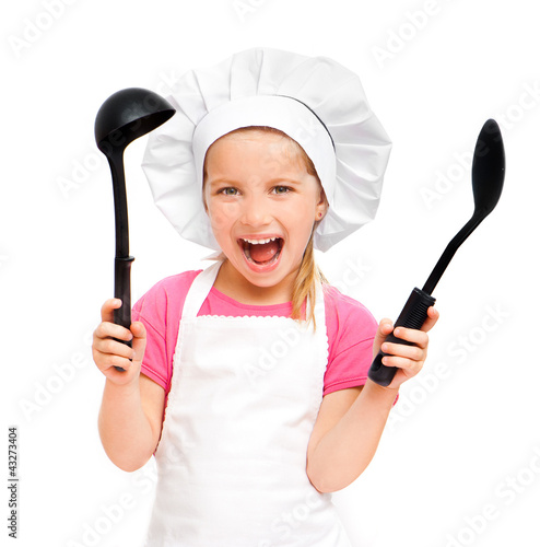 beautiful little girl with a spoon and a ladle photo