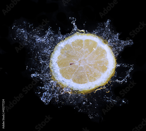 lemon water splash in a black background