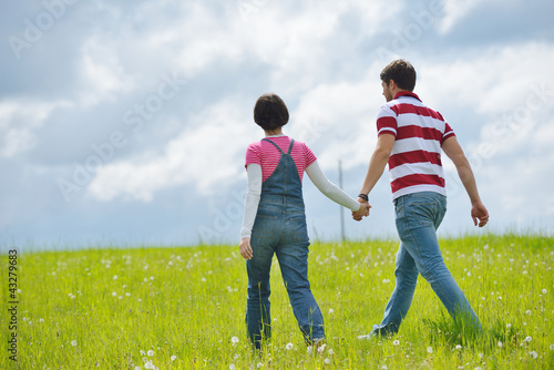 Portrait of romantic young couple smiling together outdoor