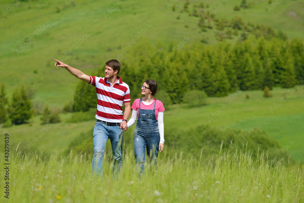 Portrait of romantic young couple smiling together outdoor