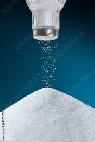 Pouring salt from a salt pot