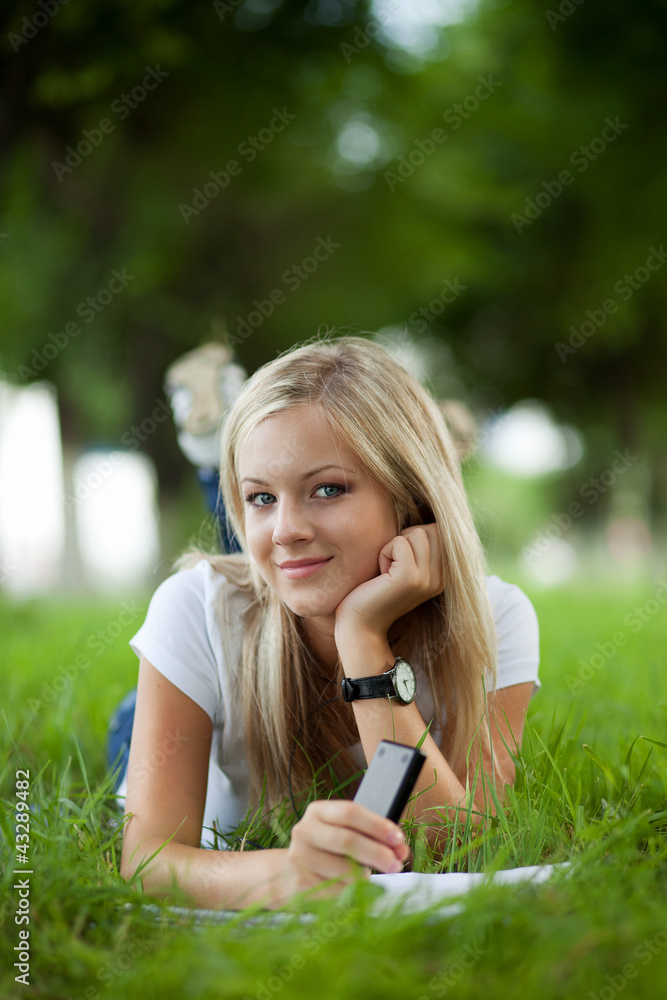 Beautifull college student in park. Outdoor shot Beautifull college student in park. Outdoor shot