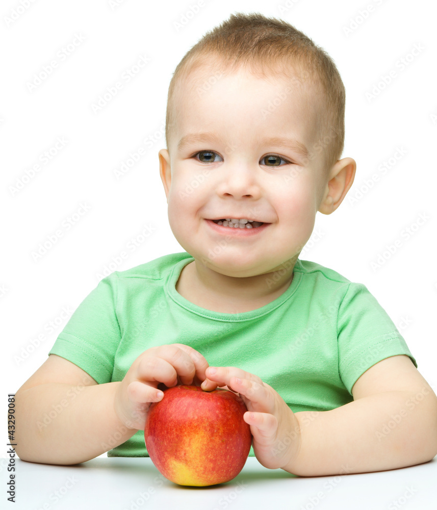 Portrait of a cute cheerful little boy with apple Portrait of a cute cheerful little boy with apple