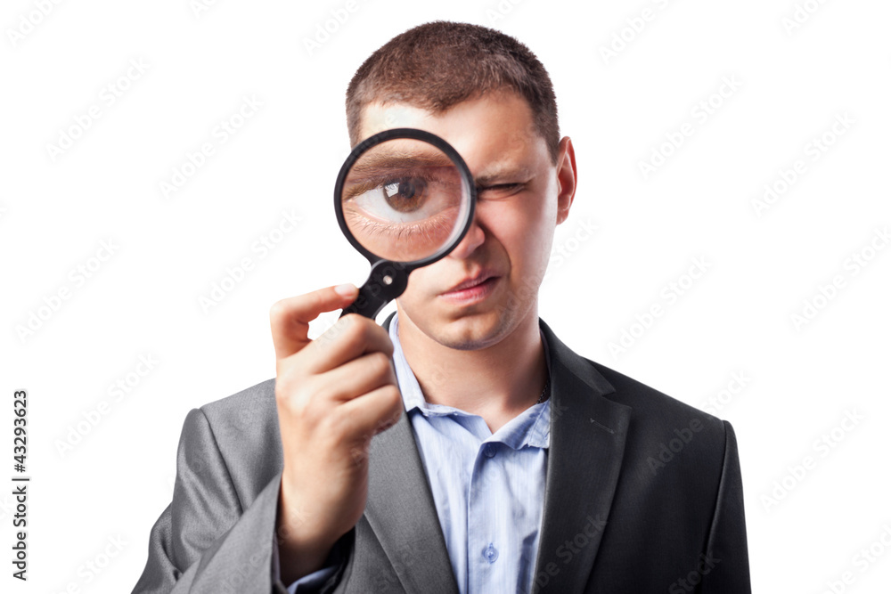 businessman in a suit looking through a magnifying glass isolate businessman in a suit looking through a magnifying glass isolate