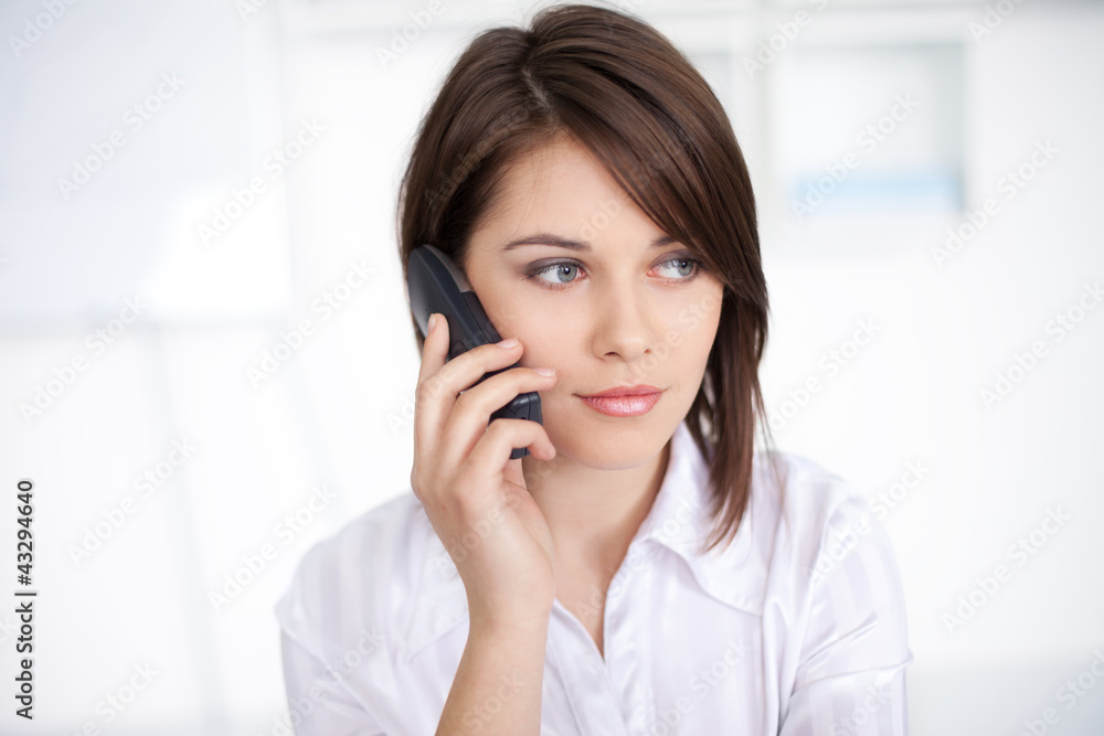 beautiful young business woman speaking on phone call at office beautiful young business woman speaking on phone call at office