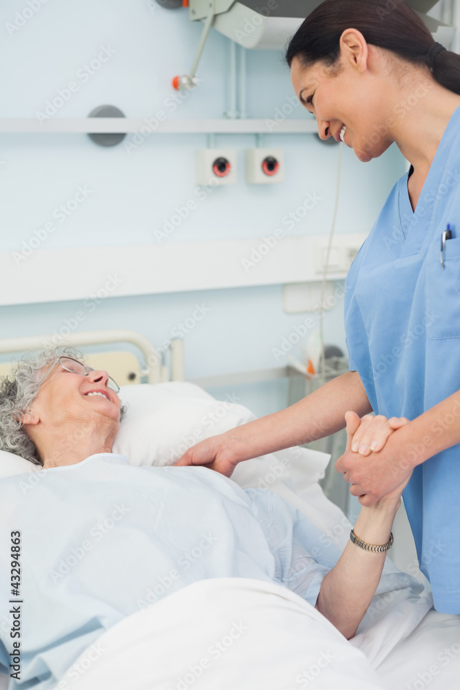 Nurse and a patient smiling Nurse and a patient smiling