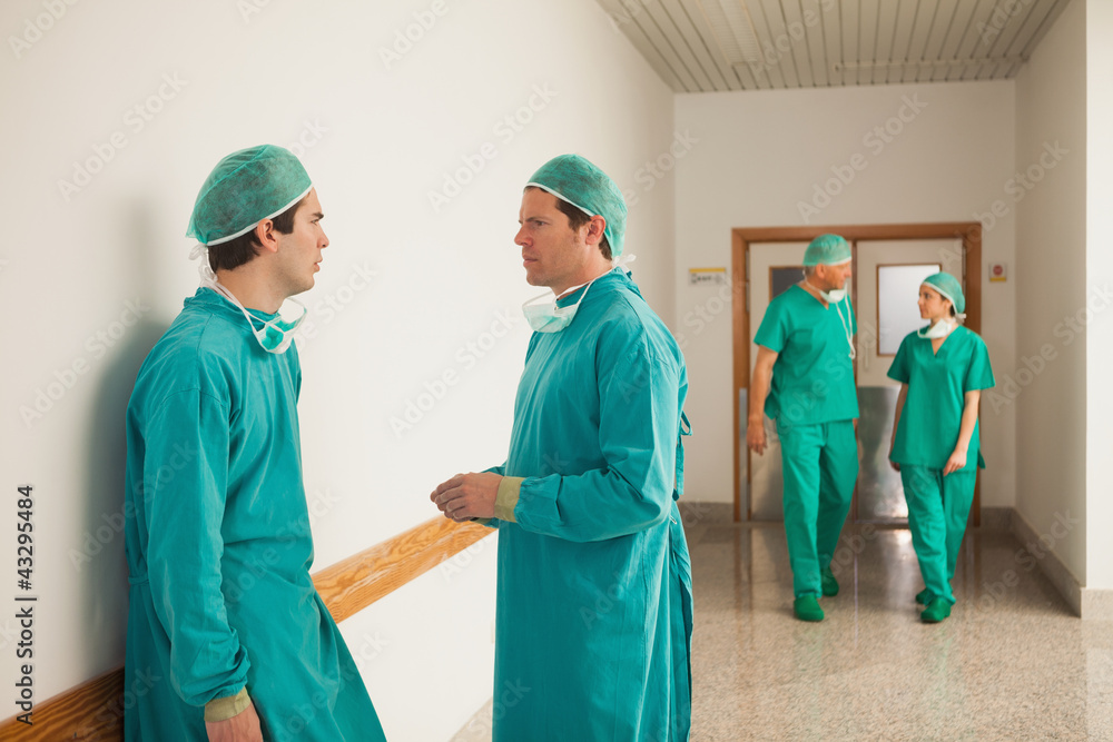 Surgeons speaking in the corridor Surgeons speaking in the corridor