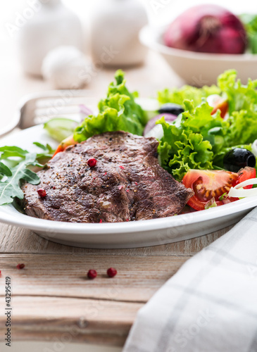 Grilled beef steak with fresh vegetables