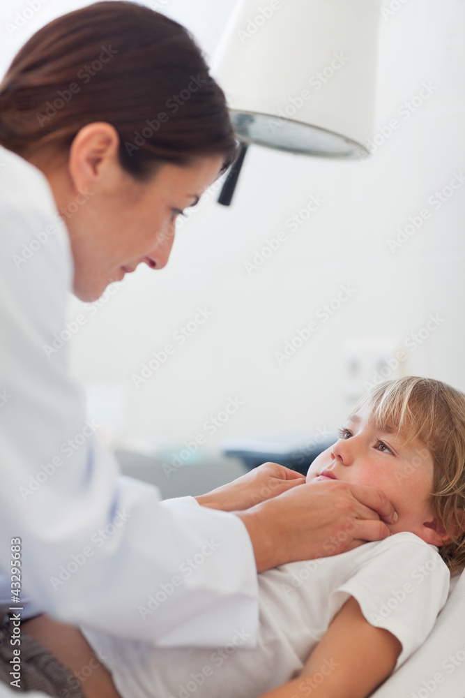 Doctor auscultating a child Doctor auscultating a child
