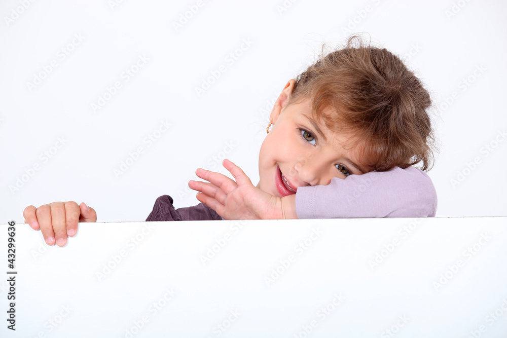 Little girl posing with blank advertisement board Little girl posing with blank advertisement board