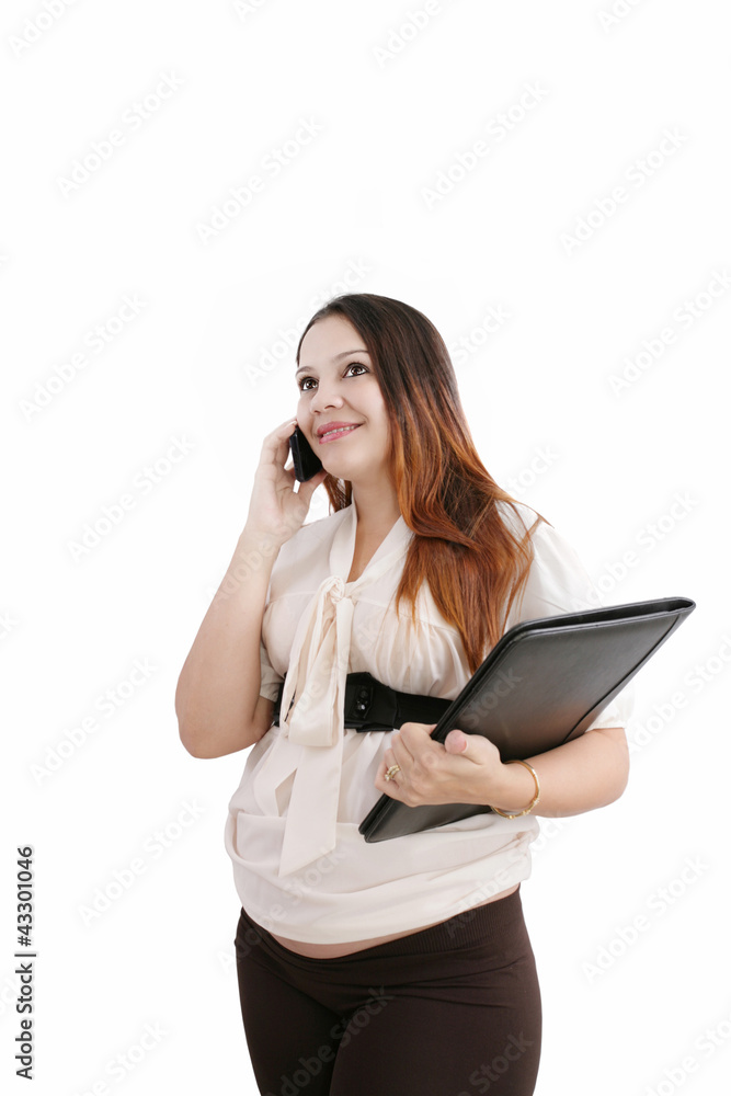 Pregnant woman making a cell phone call isolated over white Pregnant woman making a cell phone call isolated over white