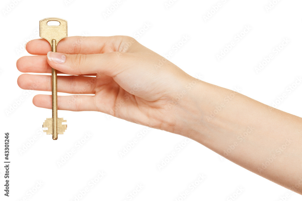 Woman hand holding gold key isolated on white background Woman hand holding gold key isolated on white background