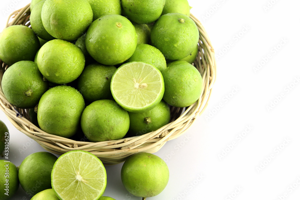 Fresh lemon in wood basket on white background Fresh lemon in wood basket on white background
