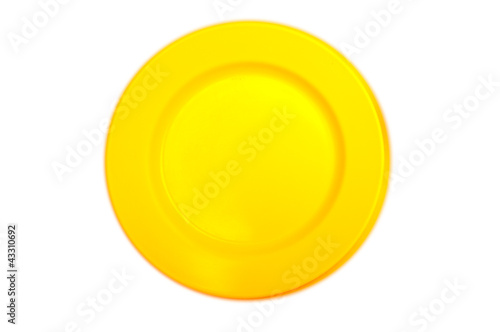 yellow plastic dish on white background