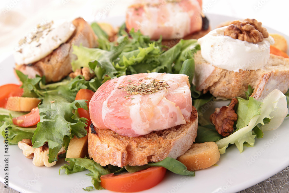 salad with walnut, bread and goat cheese