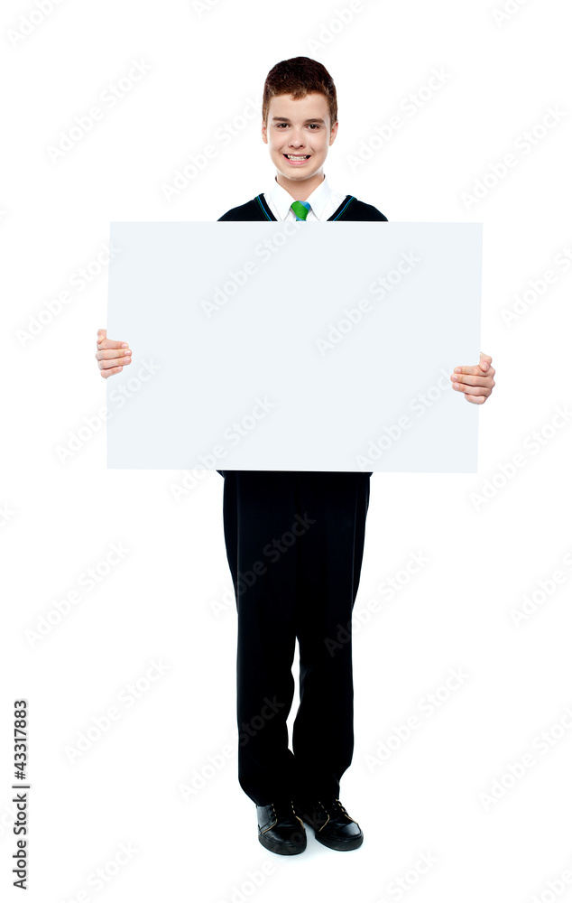 Young boy showing blank billboard Young boy showing blank billboard