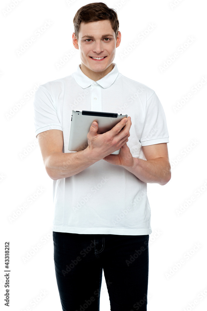 Casual teen operating touch screen device Casual teen operating touch screen device