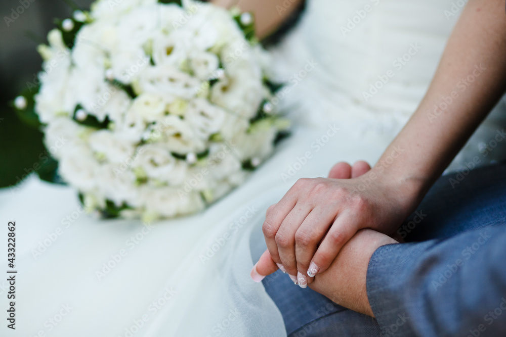 Close-up Holding Hands with Wedding bouquet Close-up Holding Hands with Wedding bouquet