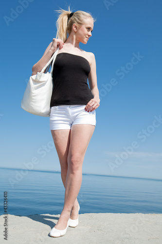 Girl walking along the pier