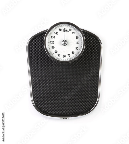 Retro weight scale isolated on white background photo
