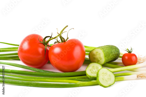 vegetables on a white background (cucumbers, tomatoes)