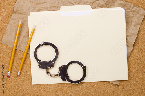 Handcuffs and Folder