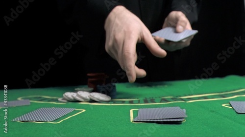 Man dealing the cards in slow motion