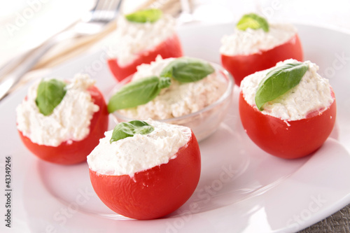 Photos stuffed tomato with cheese and basil