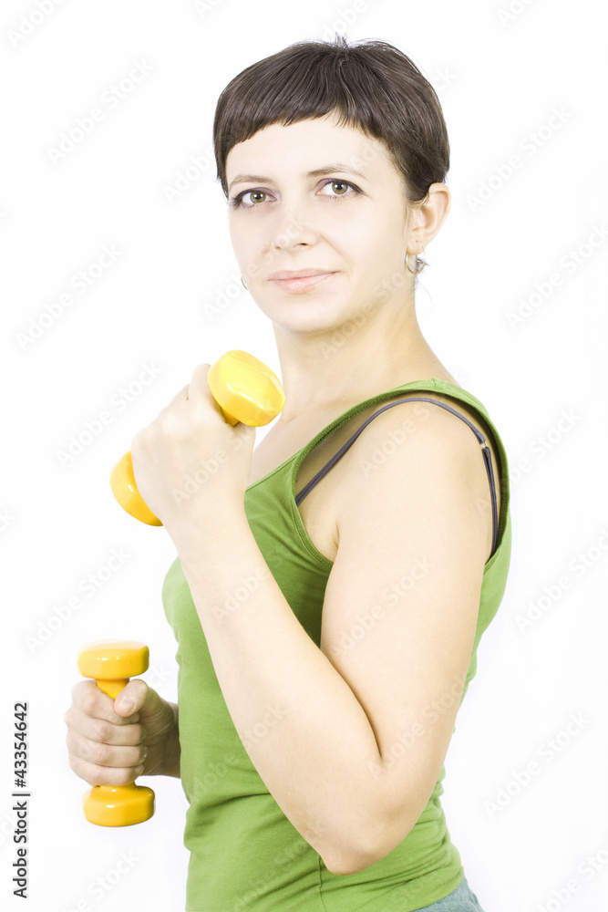 Woman at fitness training with weights isolated on white Woman at fitness training with weights isolated on white