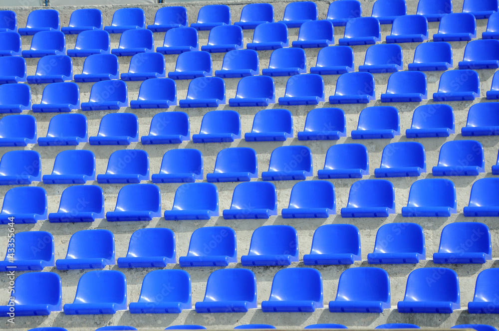 Fototapeta premium plastic blue seats on football stadium
