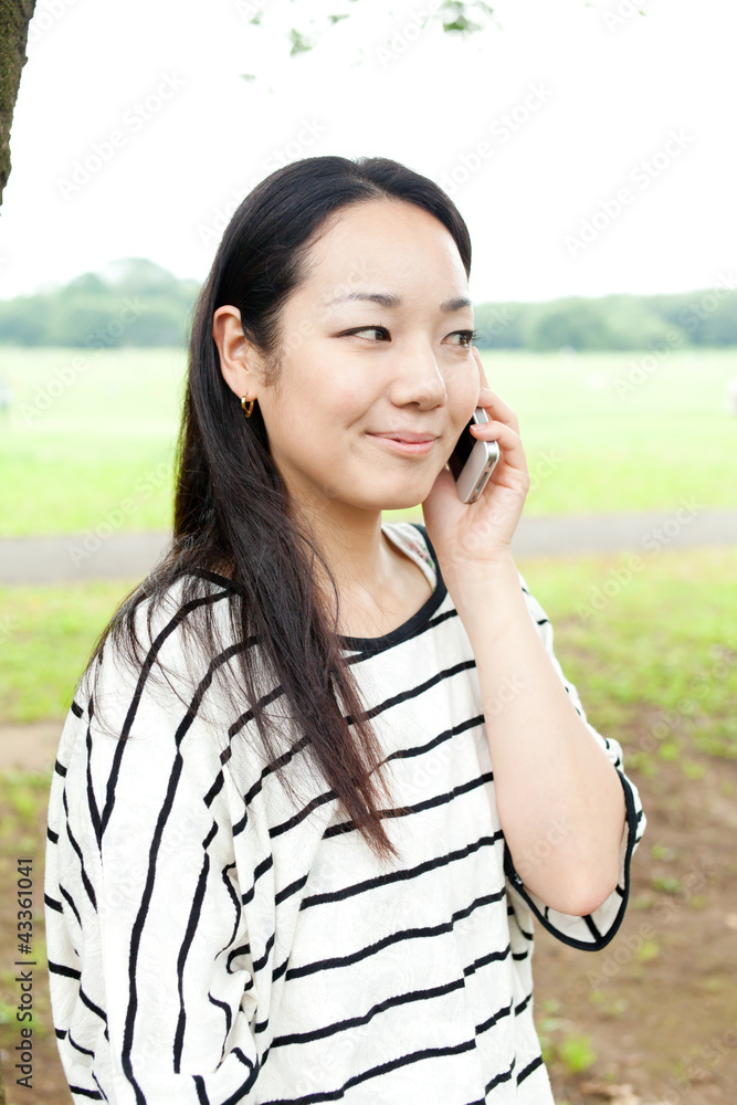Beautiful young woman in the park. Portrait of asian Beautiful young woman in the park. Portrait of asian