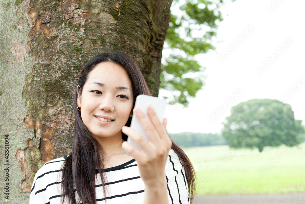 Beautiful young woman in the park. Portrait of asian Beautiful young woman in the park. Portrait of asian