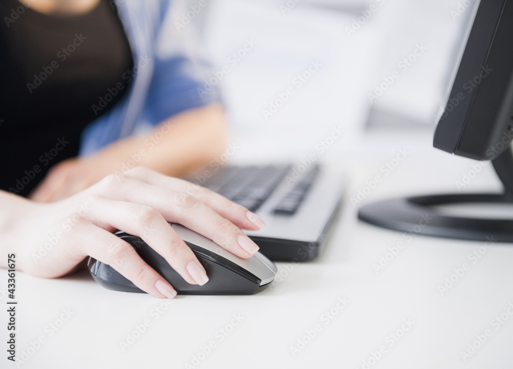 Close up of Korean woman using computer mouse Close up of Korean woman using computer mouse