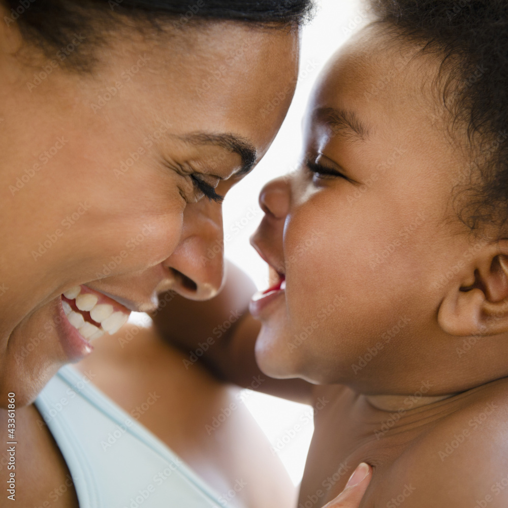 African American mother bonding with baby boy African American mother bonding with baby boy