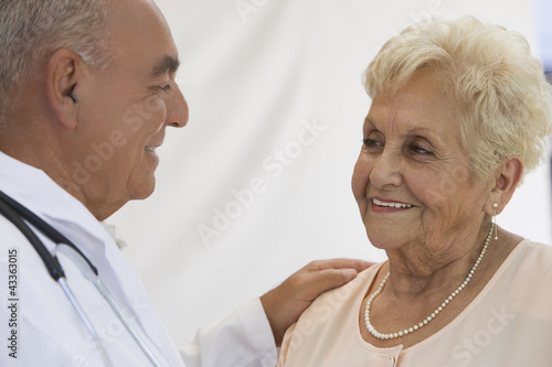 Senior woman talking with doctor