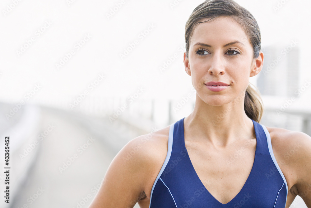 Serious Hispanic woman in sportswear Serious Hispanic woman in sportswear