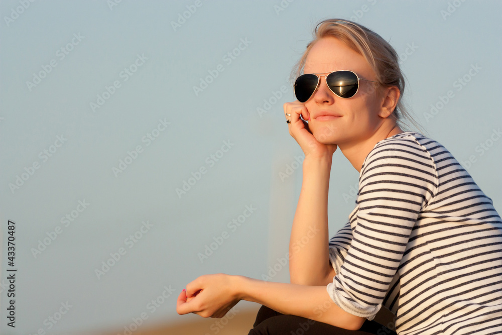 A girl admires the sunset A girl admires the sunset