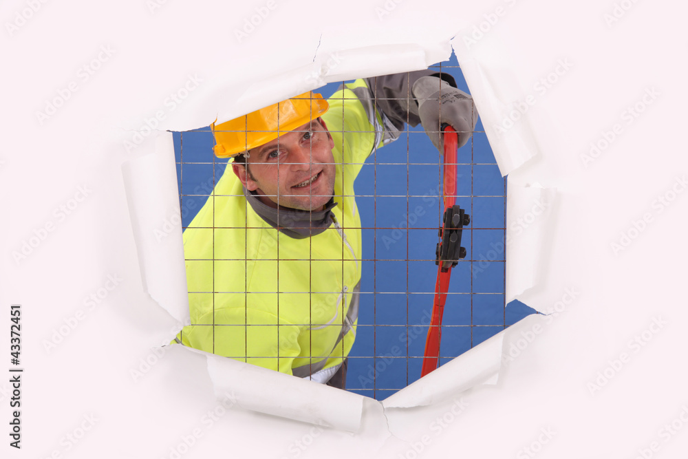 Man cutting fence Man cutting fence