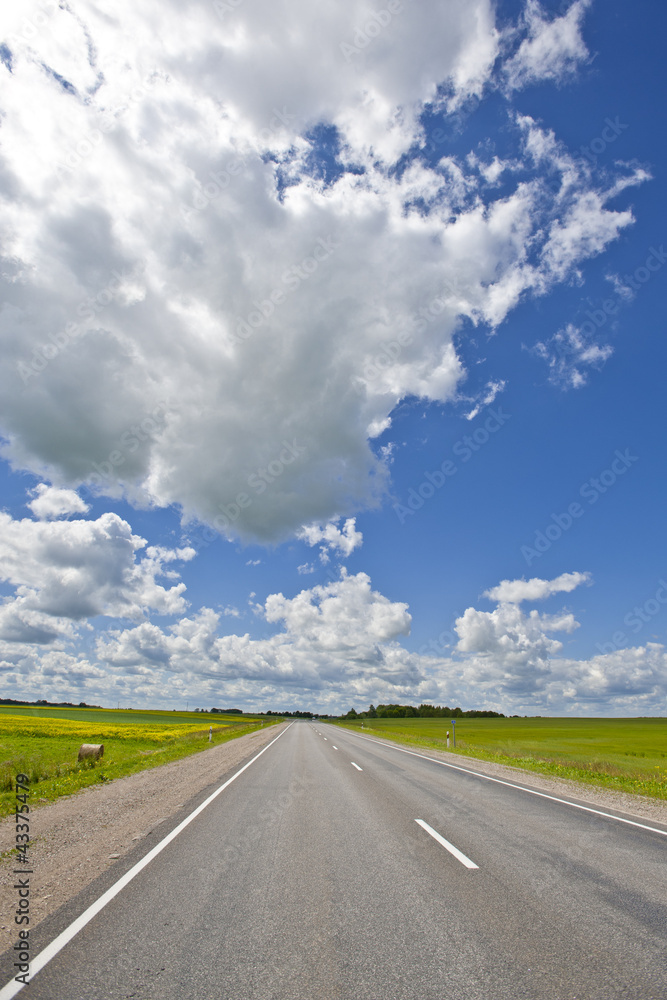 empty road and blue sky with white clouds empty road and blue sky with white clouds