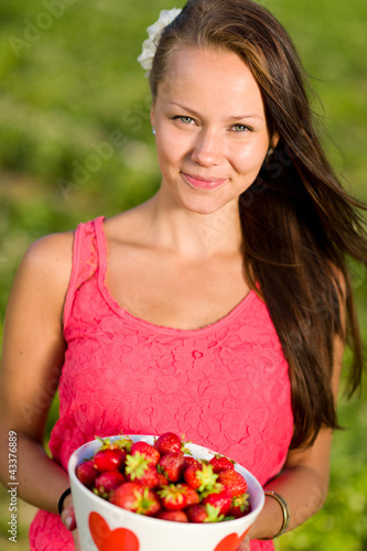 Girl and strawberries