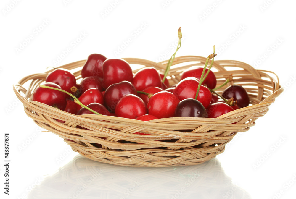 cherry in wicker bowl isolated on white cherry in wicker bowl isolated on white