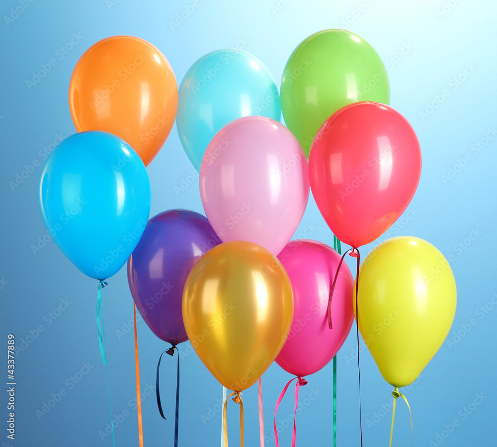 colorful balloons on blue background close-up colorful balloons on blue background close-up