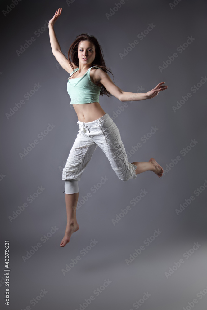 beauty girl dance on grey background