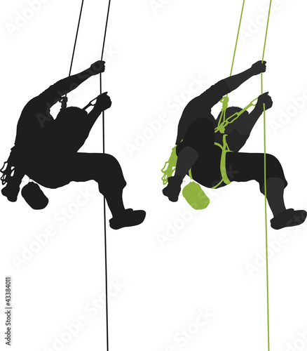 Rock climber hanging silhouette.