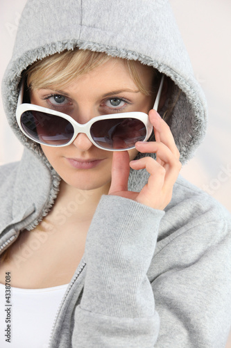 Girl with sunglasses and hoodie