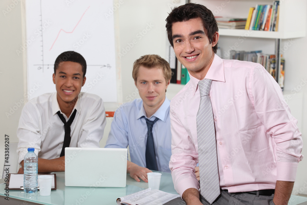 Obraz premium Three men in an office