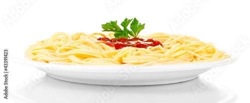 Italian spagetti cooked in a white plate isolated on white photo