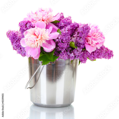 Fototapeta Naklejka Na Ścianę i Meble -  beautiful lilac and peonies flowers in metal bucket isolated